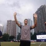 New England Patriots quarterback Tom Brady waves to fans during a promotional event in Shanghai on June 20, 2017. Brady said after a training session that he wants the NFL to follow basketball's example and become a major sport in China. The five-time Super Bowl champion says he hopes to play an NFL game in China before his brilliant career ends. / AFP PHOTO / STR / CHINA OUTSTR/AFP/Getty Images