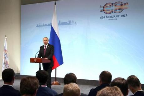 epa06076281 Russian President Vladimir Putin speaks during a news conference after the G20 summit in Hamburg, Germany, 08 July 2017. The G20 Summit (or G-20 or Group of Twenty) is an international forum for governments from 20 major economies. The summit is taking place in Hamburg from 07 to 08 July 2017. EPA/MICHAEL KLIMENTYEV / SPUTNIK / KREMLIN POOL MANDATORY CREDIT
