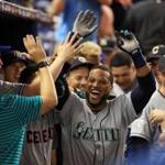 Robinson Cano celebrated his game-winning home run with American League teammates.