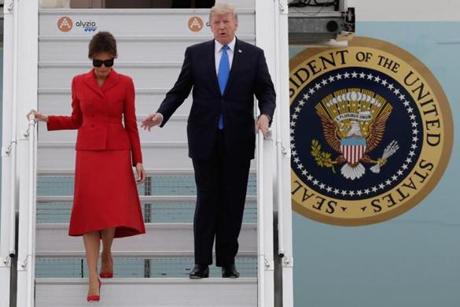 US President Donald Trump waves as he disembarks form Air Force One with First Lady Melania on Thursday at Paris' Orly airport, beginning a 24 hour trip that coincides with France's national day and the 100th anniversary of US involvement in World War I.
