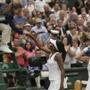 Spain's Garbine Muguruza, right, celebrates after beating Venus Williams of the United States, who shakes hands with the umpire Eva Asderaki-Moore, to win the Women's Singles final match on day twelve at the Wimbledon Tennis Championships in London Saturday, July 15, 2017. (AP Photo/Tim Ireland)