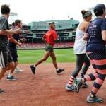 About 2,400 runners and walkers participated in the eighth annual Run to Home Base at Fenway Park Saturday morning.