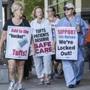 Boston, MA - 7/16/2017 - Nursing staff and supporters walk a picket line in front of Tufts Medical Center in Boston, MA, July 16, 2017. The nurses were locked out by the hospital after a one day strike. (Keith Bedford/Globe Staff)