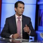 In this photo taken July 11, 2017, Donald Trump Jr. is interviewed by host Sean Hannity on his Fox News Channel television program, in New York. A Russian-American lobbyist says he attended a June 2016 meeting with President Donald Trump's son, marking another shift in the account of a discussion that was billed as part of a Russian government effort to help the Republican's White House campaign. (AP Photo/Richard Drew)