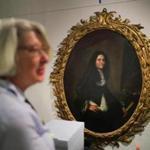 Alison Bassett, manager of archives at the research center, stood near a painting from the Lyman Preserve.