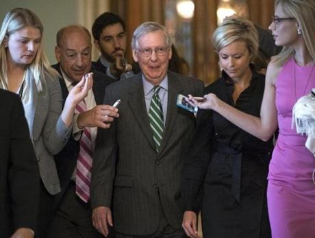 As Senate Majority Leader Mitch McConnell left the chamber on June 22, he was surrounded by journalists.
