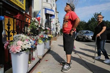 Hector Gonzalez visited the makeshift memorial outside AC Hardware in Mission Hill on Wednesday. 
