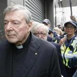 Cardinal George Pell left court under a heavy police guard Wednesday in Melbourne.