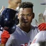 Red Sox teammates congratulated Rafael Devers after he scored his first run in the majors.