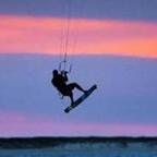 Juraj Bencat of KiteTucket Kiteboarding School rides the wind off Pocomo Point after sunset.