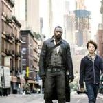 Idris Elba (left) and Tom Taylor in ?The Dark Tower.?
