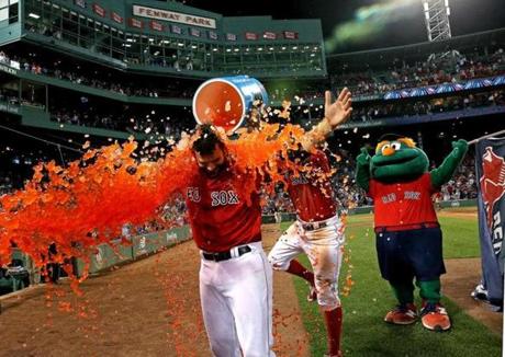 Boston, MA - 8/04/2017 - (11th inning) Boston Red Sox first baseman Mitch Moreland (18) received the ice bucket celebratory dunking after his game winning walkoff home run won it in the bottom of the eleventh inning. The Boston Red Sox host the Chicago White Sox at Fenway Park. - (Barry Chin/Globe Staff), Section: Sports, Reporter: Peter Abraham, Topic: 05Red Sox-White Sox, LOID: 8.3.3317095931.
