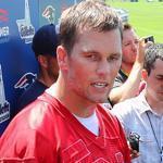 Tom Brady is surrounded by media as he spoke at the end of practice on Friday.