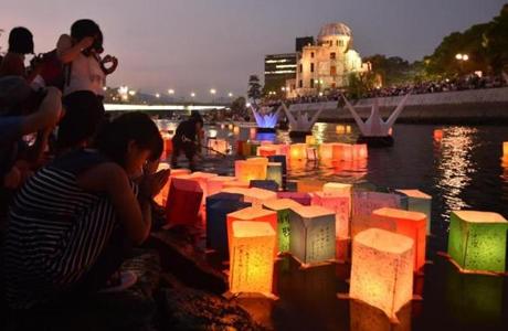Paper lanterns floated on the Motoyasu River in front of the Atomic Bomb Dome in Hiroshima on Thursday.
