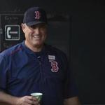 Boston Red Sox manager John Farrell smiles from the dugout in a baseball game against the Baltimore Orioles, Saturday, June 3, 2017, in Baltimore. (AP Photo/Gail Burton)