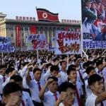 Tens of thousands of North Koreans gathered for a rally at Kim Il Sung Square carrying placards and propaganda slogans as a show of support for their rejection of the United Nations' latest round of sanctions on Wednesday Aug. 9, 2017, in Pyongyang, North Korea. (AP Photo/Jon Chol Jin)
