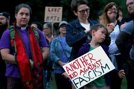 Boston, MA - 8/12/2017 - Sarah Kanouse of Jamaica Plain and daughter Genesee Brown,8, were among approximately 300 who gathered for a Protest/rally on Boston Common in reaction to violence in Charlottesville, VA. - (Barry Chin/Globe Staff), Section: Metro, Reporter: Jeremy Fox, Topic: 13vigil, LOID: 8.3.3407073052.
