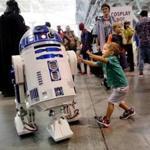 Boston, MA- August 11, 2017: Elias Winslow, 2, of Oxford, greets R2 D2 during Boston Comic Con at the at the Boston Convention & Exhibition Center in Boston, MA on August 11, 2017. Over 50,000 fans are expected to attend the event which runs through August 13. (CRAIG F. WALKER/GLOBE STAFF) section: Lifestyle reporter: 