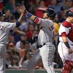 Boston, MA: August 14, 2017: As the Indians Edwin Encarnacion (center) crosses the plate after knocking in teammate Jose Ramirez (left) with a top of the sixth inning two run home run that put Cleveland ahead 7-3, Red Sox catcher Christian Vazquez looks downward at right. It was the exact same scene as the inning before, as Encarnacion hit two run home runs in back to back frames. The Boston Red Sox hosted the Cleveland Indians in a regular season MLB baseball game at Fenway Park. (Jim Davis/Globe Staff).