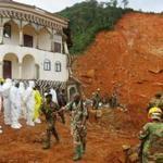 Search and rescie team members operated near a mudslide site near Freetown, Sierra Leone. 
