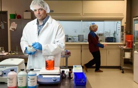 Jay Denniston, director of science for Dixie Elixirs, a cannabis company in Denver, standing in the company laboratory.
