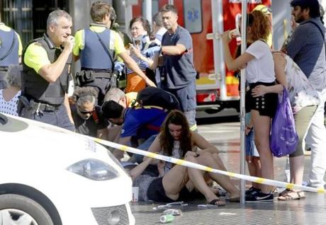 Injured people were treated after the van attack in the historic Las Ramblas district of Barcelona, Spain.
