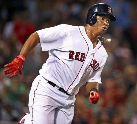 Boston, MA: August 16, 2017: 20 year old Red Sox rookie phenom Rafael Devers hustles as he legs out a double. The Boston Red Sox hosted the St. Louis Cardinals in a regular season inter league MLB baseball game at Fenway Park. (Jim Davis/Globe Staff). Boston, MA: August 16, 2017: The Boston Red Sox hosted the St. Louis Cardinals in a regular season inter league MLB baseball game at Fenway Park. (Jim Davis/Globe Staff). 
