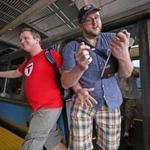 Alex Cox (left) and Dominic DiLuzio, stopwatch in hand, arrived at Wonderland Station as they tried to set a record for visiting every T station on every subway line the fastest.