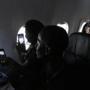 Airline passengers took photos from their seats on a special eclipse-chaser flight over the Pacific Ocean on Monday. 