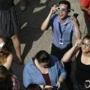 Employees stare at the eclipse at the entrance to 1 Exchange Place. Bill Greene/Globe Staff.