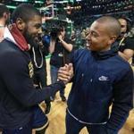 Boston, MA May 25, 2017: After the Cavaliers series clinching victory, injured Celtics guard Isaiah Thomas (right) came onto the floor, here he exchanges a hand with Cleveland's Kyrie Irving (left). The Boston Celtics hosted the Cleveland Cavaliers for Game Five of their NBA Eastern Conference Finals playoff series at the TD Garden (Globe Staff Photo/Jim Davis) 