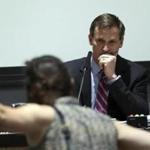 A protestor yelled at Charlottesville, Va., Mayor Mike Signer during Monday?s meeting of the city council.