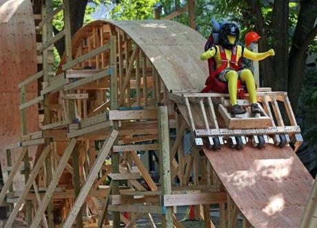 MIT student Lauren St. Hilaire went down a roller coaster constructed of wood on the MIT campus in 2015. This week, dozens of students are constructing a similar roller coaster in the quad between the East Campus buildings. 
