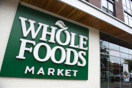 (FILES) This file photo taken on June 16, 2017 shows a Whole Foods Market sign in Washington, DC. Amazon announced on August 24, 2017 that its takeover of Whole Foods Market will close next week, as it vowed to cut grocery prices and fully integrate the chain into its retail empire. The $13.7 billion acquisition, announced in June, will close on Monday, Amazon and Whole Foods said in a joint statement one day after Whole Foods shareholders backed the deal and US antitrust officials gave it the green light. / AFP PHOTO / SAUL LOEBSAUL LOEB/AFP/Getty Images
