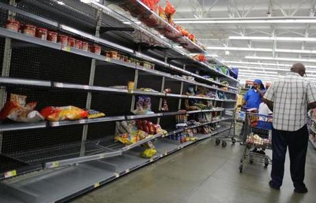 HARVEY SLIDER1 HOUSTON, TX - AUGUST 24: The chips and other bagged foods section of a Walmart store is almost empty as people prepare for the possible arrival of Hurricane Harvey on August 24, 2017 in Houston, Texas. Hurricane Harvey has intensified into a hurricane and is aiming for the Texas coast with the potential for up to 3 feet of rain and 125 mph winds. (Photo by Joe Raedle/Getty Images)
