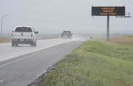 Motorists travelled south on Interstate Highway 37 pass a traffic sign warning of weather conditions in Corpus Christi, Tex.
