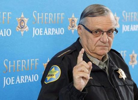 FILE - In this Dec. 18, 2013, file photo, Maricopa County Sheriff Joe Arpaio speaks at a news conference at the Sheriff's headquarters in Phoenix, Ariz. President Donald Trump has pardoned former sheriff Joe Arpaio following his conviction for intentionally disobeying a judge's order in an immigration case. The White House announced the move Friday night, Aug. 25, 2017, saying the 85-year-old ex-sheriff of Arizona's Maricopa County was a 