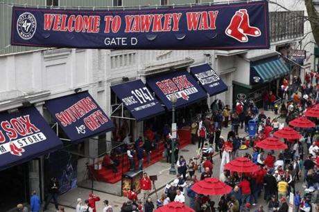 Yawkey Way was crowded with fans and activity before a game at Fenway Park in 2014.
