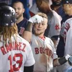 TORONTO, ON - AUGUST 28: Christian Vazquez #7 of the Boston Red Sox is congratulated by teammates in the dugout after hitting a two-run home run in the seventh inning during MLB game action against the Toronto Blue Jays at Rogers Centre on August 28, 2017 in Toronto, Canada. (Photo by Tom Szczerbowski/Getty Images)