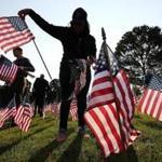 Volunteers in Weston place 3,000 flags on the Weston Town Green to commemorate those who died on 9/11 in the terrorists attacks in 2001. Suzanne Kreiter/Globe staff