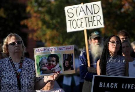 Scores of people gathered  to show support for the family of an 8-year-old biracial boy who, according to his family, was taunted with racial slurs and hung from a tree.
