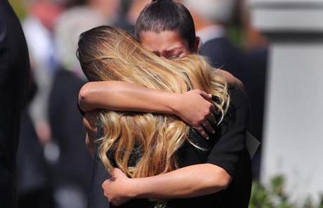 DENUCCI SLIDER Newton-09/13/17-A funeral service was held for former boxer, State Rep and State Auditor, Joe DeNucci at Our Lady Help of Christians Church. Two women hug at the end of the service. John Tlumacki/Globe Staff(metro)
