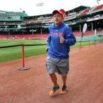 Boston-07/15/2017-Dave McGillivray runs along the warning track of Fenway Park as he checked out the course for a September 15th 2017 marathon fundraiser to be held inside the ballpark. It will be the first time a marathon will be held inside a major league ball field. He has dozens of runners already signed up for the event. John Tlumacki/Globe Staff(sports)