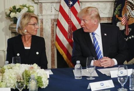 President Donald Trump looked toward Education Secretary Betsy DeVos.
