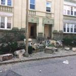 Masonry fell from the front side of a building at 68 Egmont St., in a partial structure collapse in Brookline Friday.