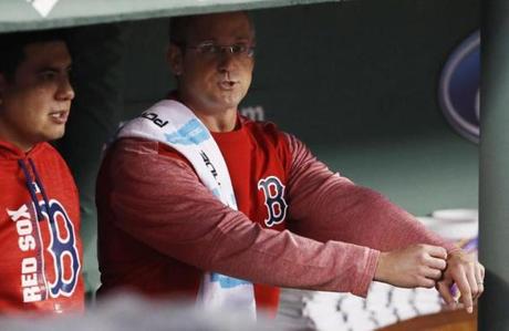 Boston Red Sox assistant athletic trainer Jon Jochim looks on from the dugout before a baseball game between the Boston Red Sox and the Toronto Blue Jays at Fenway Park in Boston, Wednesday, Sept. 6, 2017. (AP Photo/Winslow Townson)
