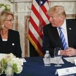 President Donald Trump looked toward Education Secretary Betsy DeVos.