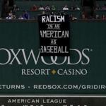 This banner protesting racism was unfurled over the Green Monster during the Sept. 13 game at Fenway Park.