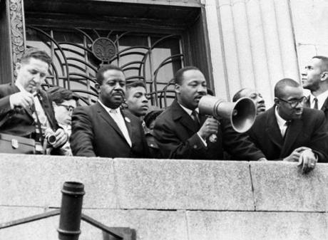 Martin Luther King, Jr. addressed a crowd at the Patrick Campbell School in Roxbury in 1965. 
