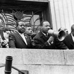 Martin Luther King, Jr. addressed a crowd at the Patrick Campbell School in Roxbury in 1965. 